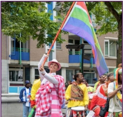 Parade participant waving a flag